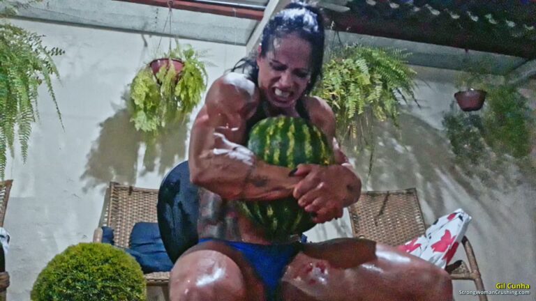Gil Cunha destroys watermelons using her muscular arms