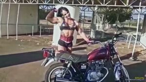 Gil Cunha lifts a heavy motorcycle