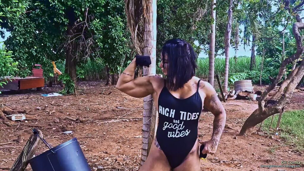 Gil Cunha crushes metal bucket in her muscular arms
