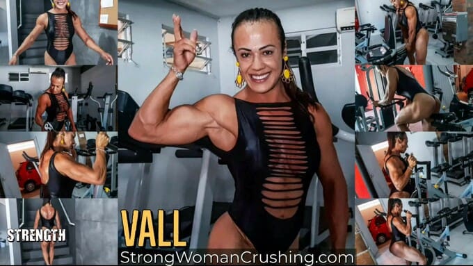 Vall posing and lifting gym equipment