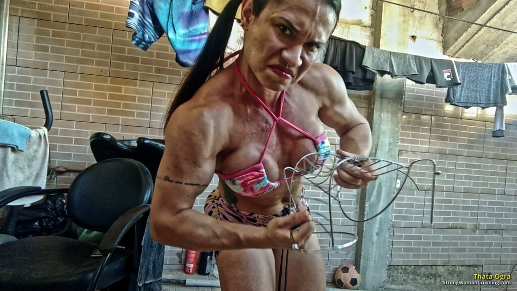 Thata Ogra Smashes Metal Pieces with her Muscular Arms