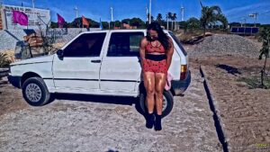 Tereza big and strong lifts a car with her immense strength