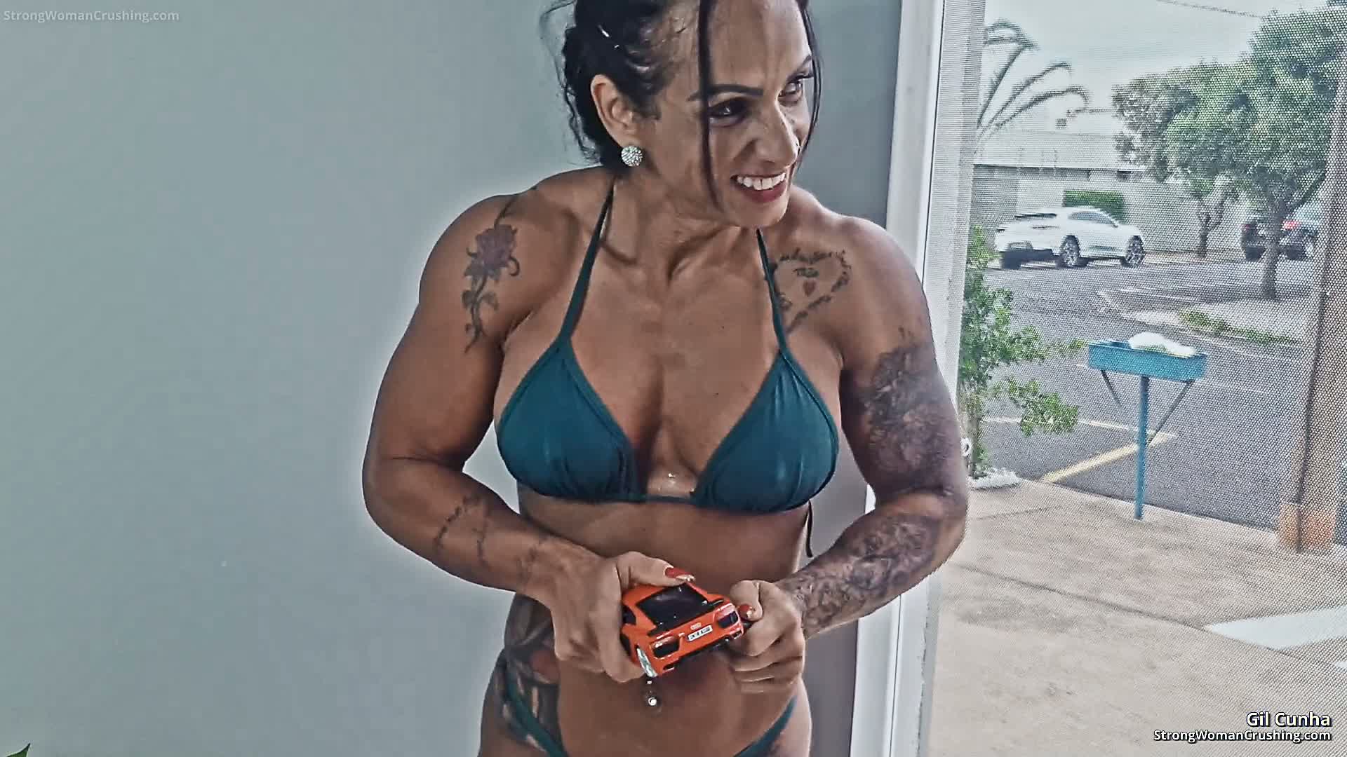 Gil Cunha destroys a red metal toy car