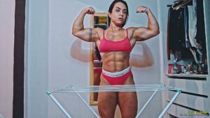 Karla Bachiega bends and crushes a metal clothing stand
