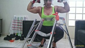 Karla Bachiega uses huge biceps and destroys a metal ladder