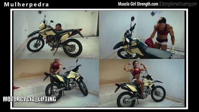 Mulherpedra tries to lift a heavy motorcycle