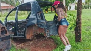 Gil cunha lifts a scrap car and toys with it