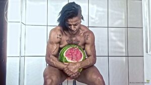 Tai smashes a watermelon