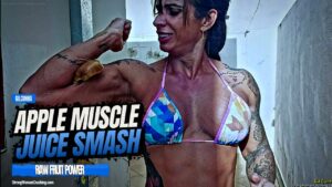 Gil Cunha smashes some apples in her muscles