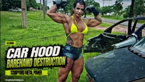 Gil Cunha destroys a car hood with her strength