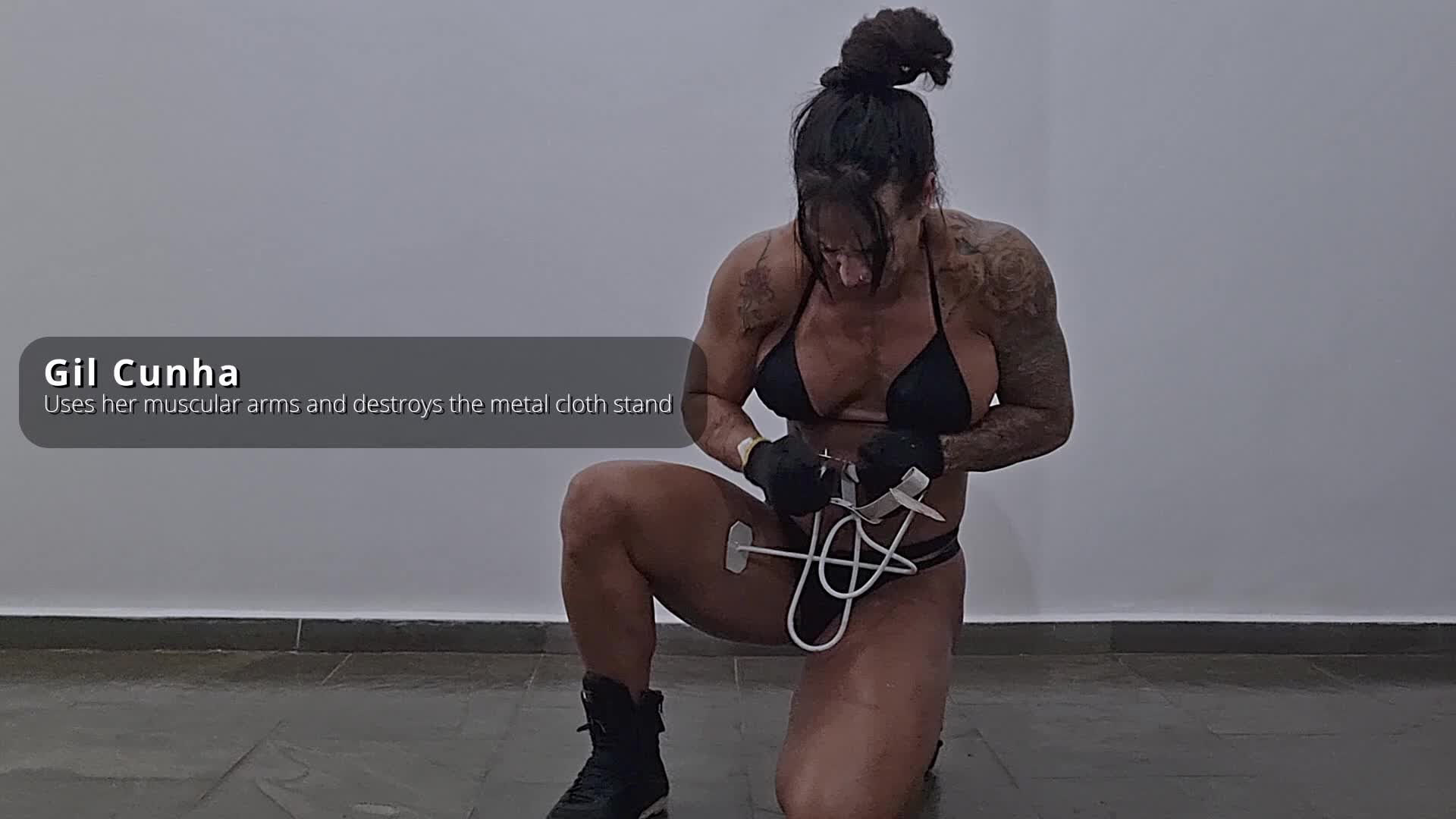 Gil Cunha destroys some metal pieces with her might arms