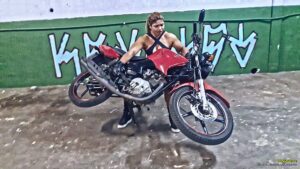 Rogatona lifts a motorcycle