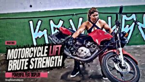 Rogatona lifts a motorcycle