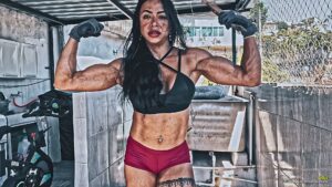 Lidia test her strength against a wooden box