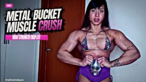 Samy squeezes metal bucket in her muscles
