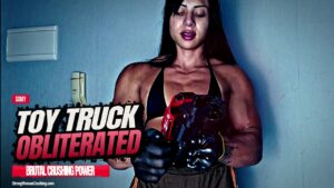 Samy crushes a toy pickup truck