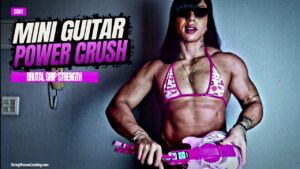 Samy grabs a mini guitar and destroys it